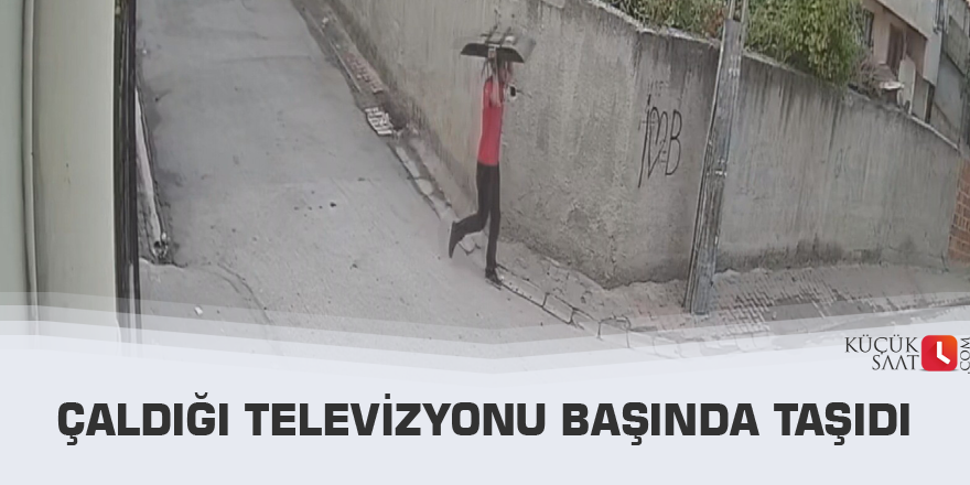 Çaldığı televizyonu başında taşıdı