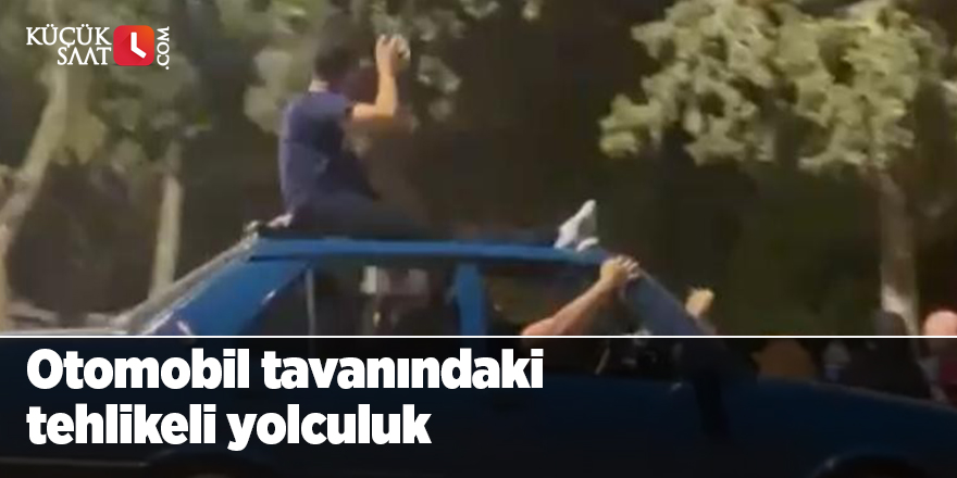 Otomobil tavanında tehlikeli yolculuk