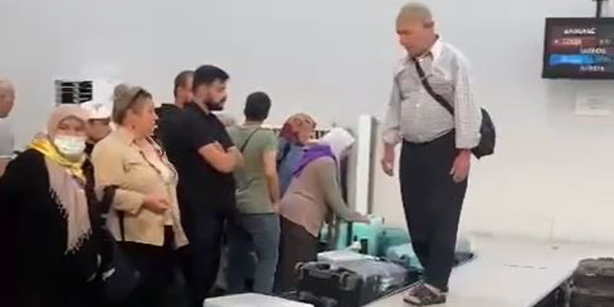 Adana'da hacdan dönen vatandaşların valiz mücadelesi