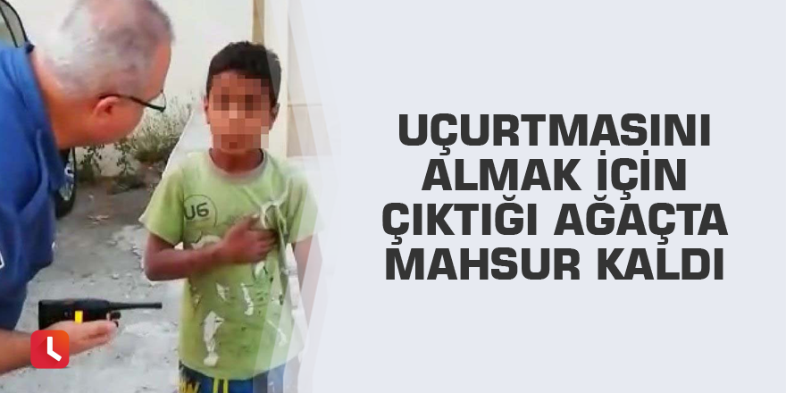 Uçurtmasını almak için çıktığı ağaçta mahsur kaldı